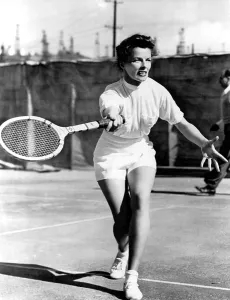 Tennis Court Prints: PAT AND MIKE, Katharine Hepburn playing tennis on the set, 1952