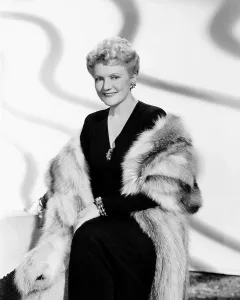 Minna Prints: PERILOUS HOLIDAY, Minna Gombell, modeling a blue fox cape, 1946