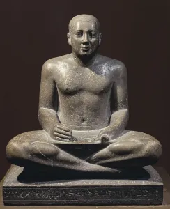 Petamenophis. 712 - 657 BC. Petamenophis (Nut) represented as scribe. Sculpture from the 25th Dynasty. Egyptian art. Third Intermediate Period. Sculpture on rock. EGYPT. Cairo