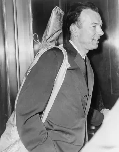 Mccarthyism Prints: Pete Seeger (b. 1919) arrives at Federal Court with his guitar over his shoulder