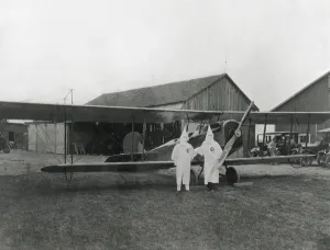 Nativists Prints: Two pilots in Ku Klux Klan shrouds pose with their aircraft in Dayton
