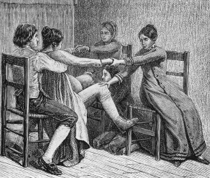 At Home Prints: Pioneer birth scene of two women and two men assist during childbirth of ca
