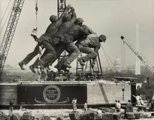 Placement the statue depicting marines raising the American flag on Mount Suribachi, Iwo Jima. Sculpture for the Marine Memorial by Felix W