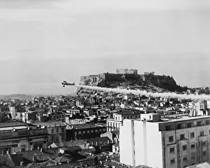 Lcgr1411 Prints: A plane dusts the ancient city of Athens with DDT prevent the spread of cholera in Greece from Egypt