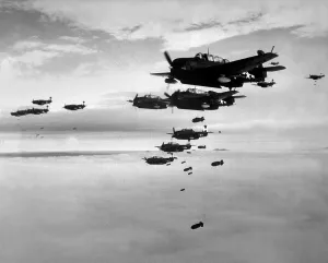 Bombers Prints: Planes from the USS Essex aircraft carrier dropping bombs on Hokadate