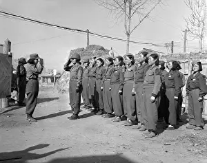 Inspection Prints: A platoon of the Korean Women's Army prepares for inspection at a command post