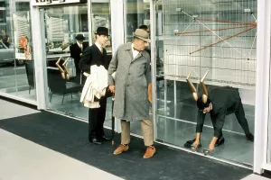 PLAYTIME, Jacques Tati (center, in coat), 1967