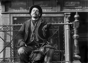 Sidewalk Prints: Pleading beggar holds his hand out on the street in New York City, 1910 (BSLOC_2018_1_136)