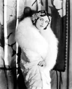 Story Fur Prints: POLA NEGRI wearing a white knee-length fur Llate, late 1920s