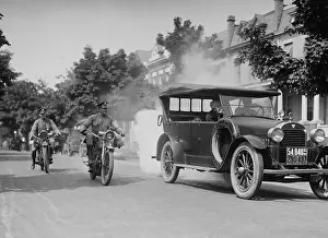 Police Prints: Police on motorcycles trailing a car with heavy smoke exhaust