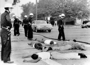 Images Dated 3rd March 2007: Police officers stand over suspected looters during the fourth day of riots in Watts