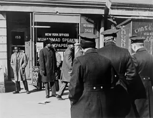 Street Scenes Prints: Police standing outside a Black Muslims office on a New York City Street. 1965