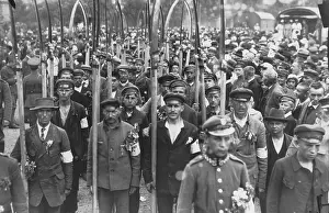 Eastern European Prints: Polish army volunteers with scythes in a crowd of people in July 1920