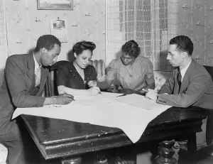 Document Prints: Polly Johnson (2nd from right) is assisted in signing an affidavit for the NAACP