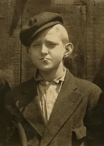 Squinting Prints: Portrait of a boy smoking, original caption: A