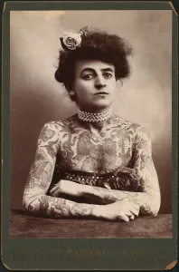 Images Dated 27th February 2008: Portrait of a woman showing images tattooed on her body