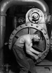 Wrench Prints: Power house mechanic working on steam pump. Photo by Lewis Hine, 1920
