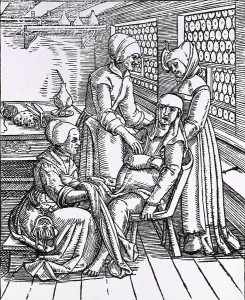 Switzerland Prints: A pregnant woman sitting in a birthing chair is being attended to by three midwives