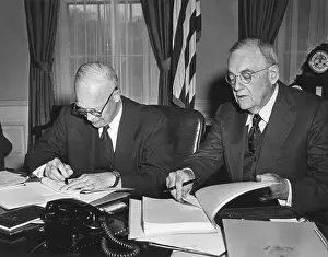 Washington D Prints: Pres. Eisenhower and John Foster Dulles signing Proclamations of Ratification relating to Germany