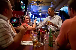Casual Prints: President Barack Obama has a beer with patrons at the Pump Haus Pub and Grill in Waterloo