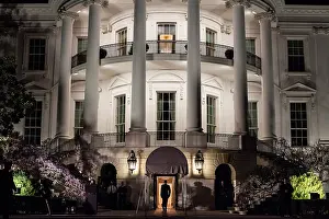 South Portico Prints: President Barack Obama enters the South Portico of the White House at night on March 30