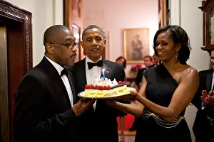 Ladies Prints: President Barack Obama and Michelle Obama present a birthday cake to Assistant Usher Reggie Dickson