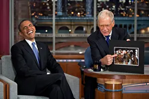 Entertainers Prints: President Barack Obama reacts to a photograph while taping of Late Show with David Letterman'
