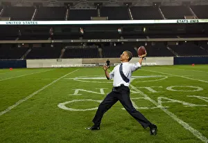 Football Prints: President Barack Obama throws a football at Soldier Field