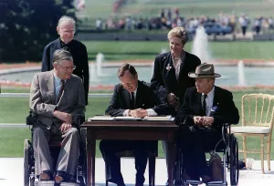 Wheelchair Prints: President Bush signs into law the Americans with Disabilities Act of 1990 on the South Lawn of the White House