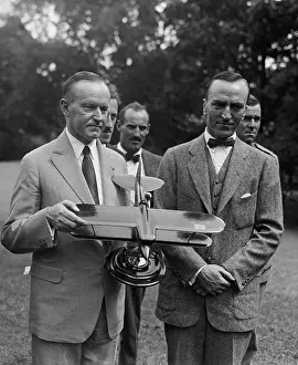 Aviators Prints: President Calvin Coolidge examines a model airplane