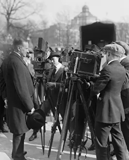 Reporters Prints: President Calvin Coolidge stands in front of newsreel cameras