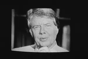 Transmission Prints: President Carter worn a cardigan sweater for his first televised fireside chat from the White House starting a joking