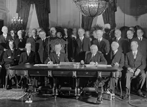 Calvin Prints: President Coolidge signs Kellogg Treaty in the East Room of the White House on Jan