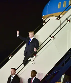 Steps Prints: President Donald Trump arrives at Paya Lebar Air Base