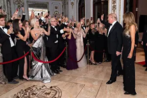 Applauding Prints: President Donald Trump and First Lady Melania Trump arrive at New Year's Eve celebration at Mar-a-Lago on Dec