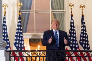 Sick Prints: President Donald Trump gestures thumbs up to supporters after his discharge from Walter Reed hospital on Oct