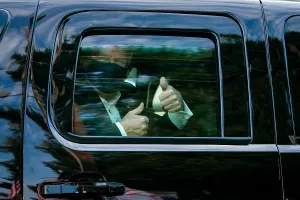 Sick Prints: President Donald Trump gestures thumbs up to his supporters during a drive outside of Walter Reed Medical Center during