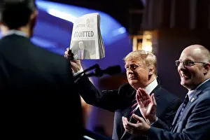 Clapping Prints: President Donald Trump holds up a USA Today newspaper with the headline ACQUITTED at the National Prayer Breakfast