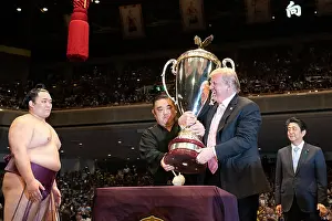 Speaking Prints: President Donald Trump, presents a trophy at the Sumo Grand Championship at the Ryogoku Kokugikan Stadium in Tokyo