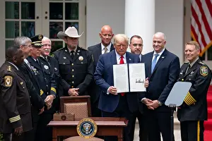 10 People Prints: President Donald Trump signs an executive order