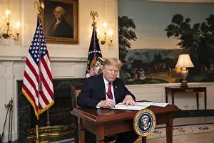 Immigration Prints: President Donald Trump signs an Immigration Proclamation in the Diplomatic Reception Room of the White House