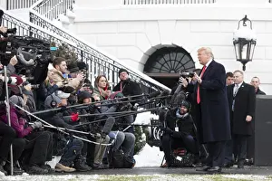 Adults Prints: President Donald Trump speaks to the press before leaving to address the American Farm Bureau Federation Convention