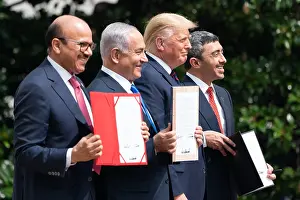 Israel Prints: President Donald Trump stands with Middle East leaders displaying signed copies of the Abraham Accords