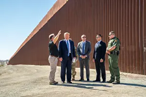 Kevin Prints: President Donald Trump, visits a walled section of the US-Mexico border at Otay Mesa
