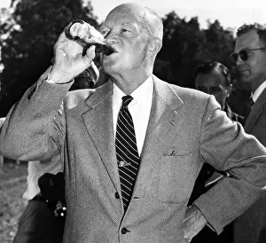 Images Dated 11th March 2007: President Dwight D. Eisenhower downing a soft drink