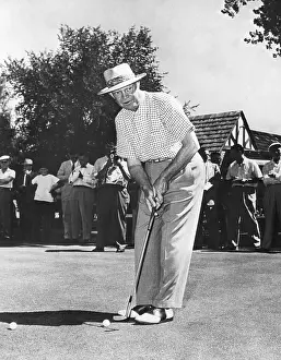Cameras Prints: President Dwight Eisenhower on a golf course putting green