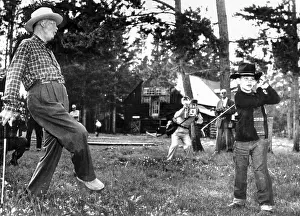 Grandson Prints: President Eisenhower adds a little body English to David Eisenhower's golf swing