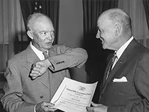 Support Prints: President Eisenhower receives a membership from National Rifle Association Pres