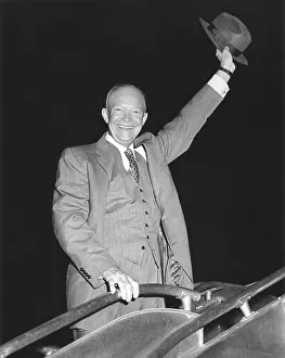 Politicians Republicans Prints: President Eisenhower waving his hat from airplane steps