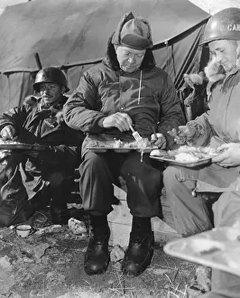 President-elect Dwight Eisenhower eating with soldiers in Korea on Dec. 1952